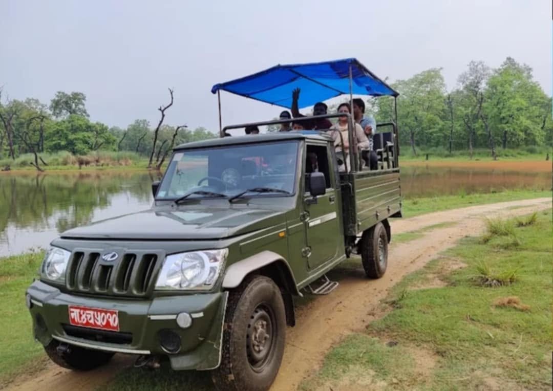 Mahindra Bolero safari jeep with passengers in Chitwan